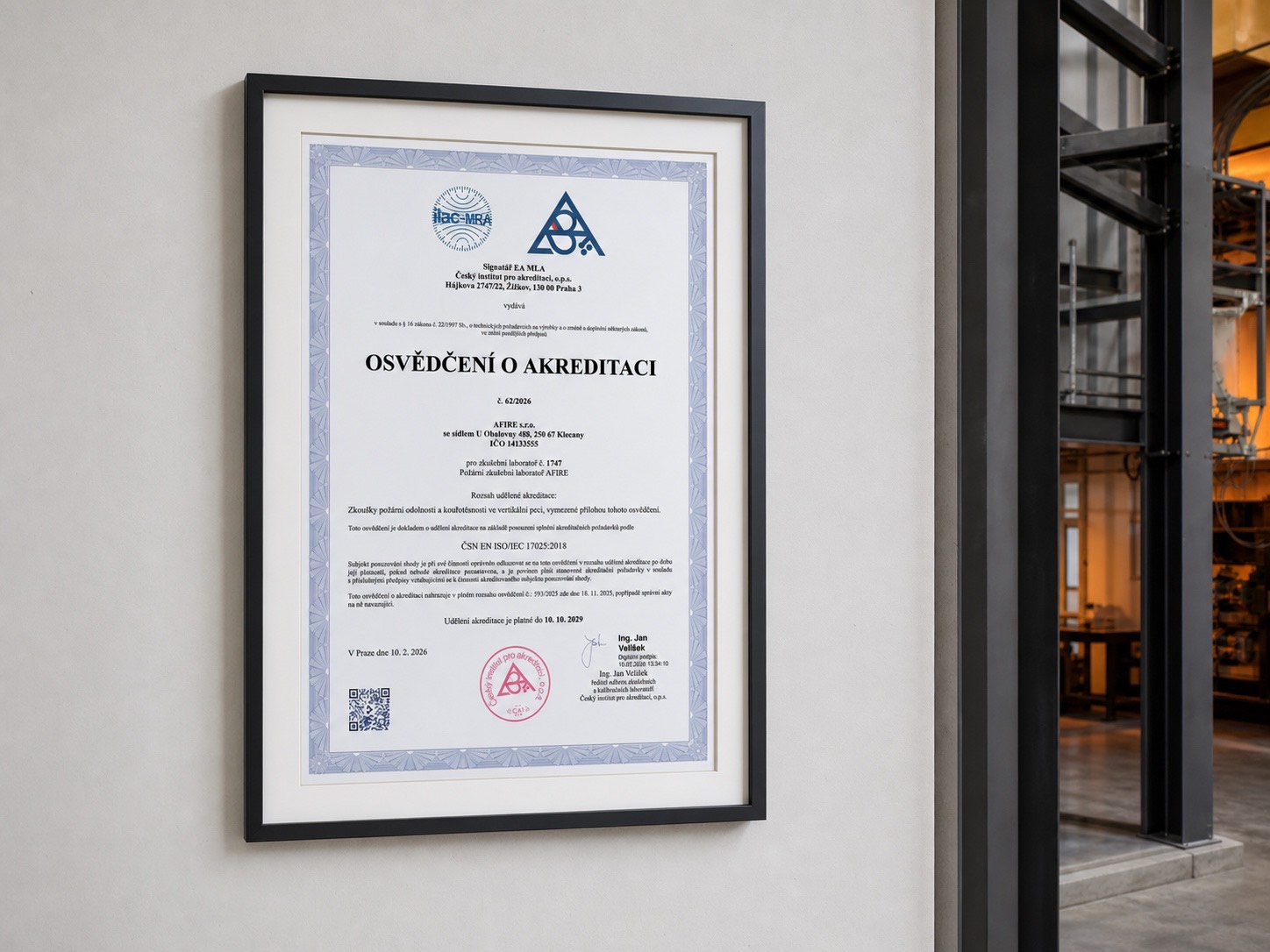 AFIRE Certificate of Accreditation in a frame in a fire laboratory environment
